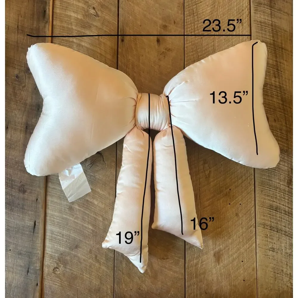 URBAN OUTFITTERS HOME light pink satin “BOW” throw pillow